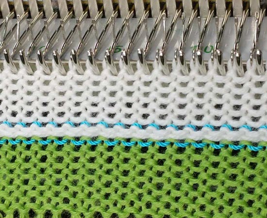 Scrap and ravel cast-on technique in machine knitting